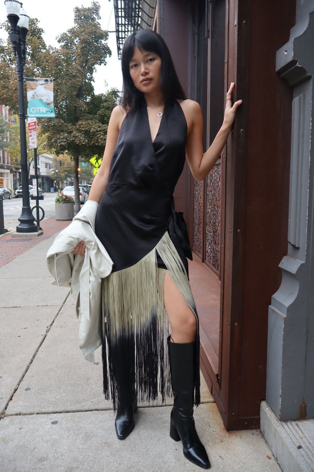 Ivory trench carried with the fringe halter dress